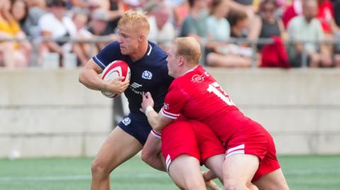 Arron Reed in action for Scotland