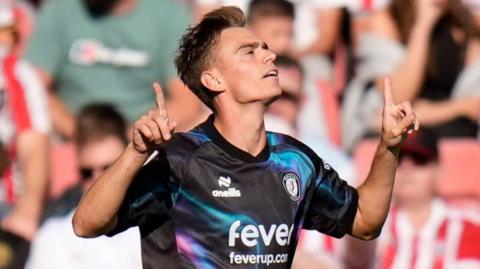 Scott Twine celebrates scoring