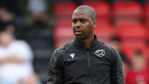 Darren Byfield takes a pre-match warm-up as first team coach at Walsall