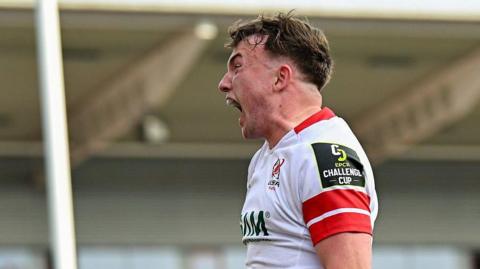 Jack Murphy side profile with his mouth wide open as he shouts after scoring a try