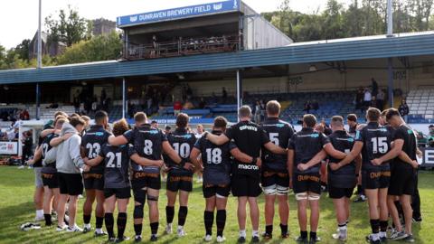 Ospreys players in a huddle