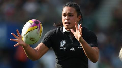 Layla Sae holds her hands out to catch a ball during a pre-match warm-up for New Zealand during the World Cup