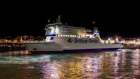 Brittany Ferries on the sea in night time at St Peter Port, Guernsey