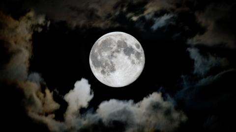 The moon viewed through the clouds