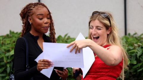 A student receives their A-level results at a school in south London, Britain, 14 August 2025. Tens of thousands of students across the UK are receiving their A-Level results on 14 August, with grades expected to return to pre-pandemic levels.