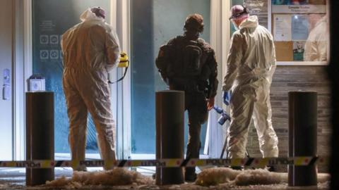 Police and forensic experts inspect the site of the explosion at the US embassy in Oslo, Norway. Photo: 8 March 2026