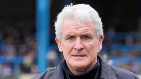 Mark Hughes before a Carlisle home game 
