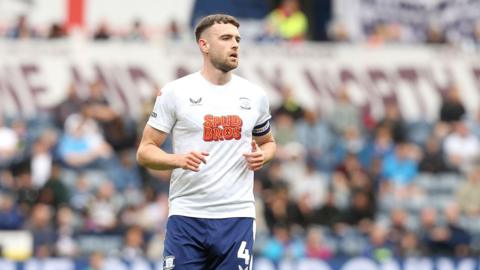 Ben Whiteman playing for Preston North End in his white and blue home kit