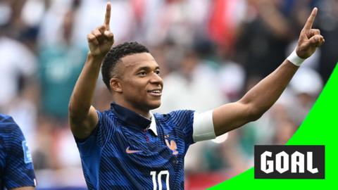 Kylian Mbappe fingers in the air 