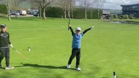 Freddie celebrating his hole-in-one on the course
