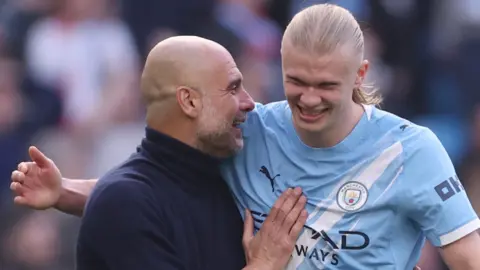 Pep Guardiola and Erling Haaland