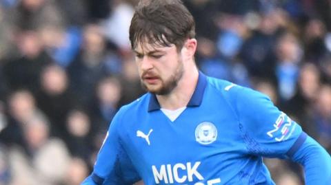 Cian Hayes in action for Peterborough United