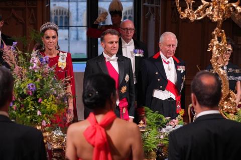 Macron and King Charles, with Princess of Wales standing alongside, at state banquet table