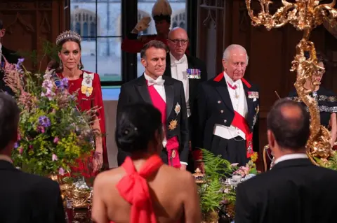 Macron and King Charles, with Princess of Wales standing alongside, at state banquet table
