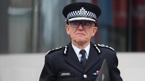 Metropolitan Police Commissioner Sir Mark Rowley in uniform and hat looking ahead