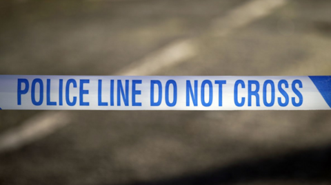A blue and white police tape