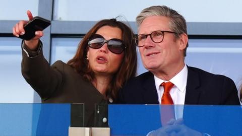 Sir Keir Starmer and his wife Victoria enjoy the action on day three of the St Leger Festival at Doncaster Racecourse