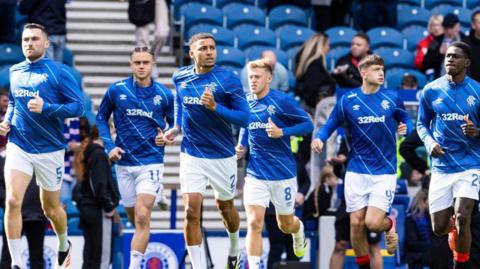 Rangers players warming up before Sunday's derby draw with Celtic at Ibrox