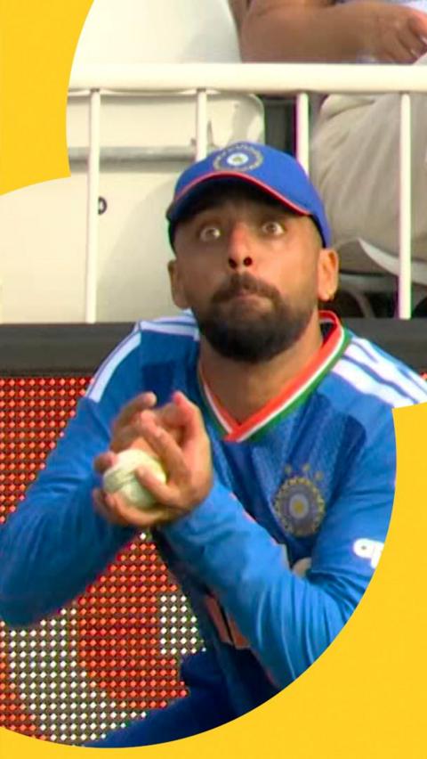 Varun Chakravarthy with his eyes wide open as he catches the ball as England face India in the men's T20.