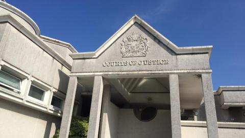 The outside of Truro Crown Court, a grey stone building with pillars.