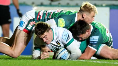 Tommy Freeman dives to score a try for Northampton at Welford Road