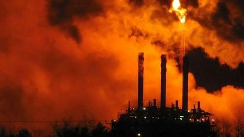 Mossmorran is in darkness. The flare is illuminating the dark sky with a red light.