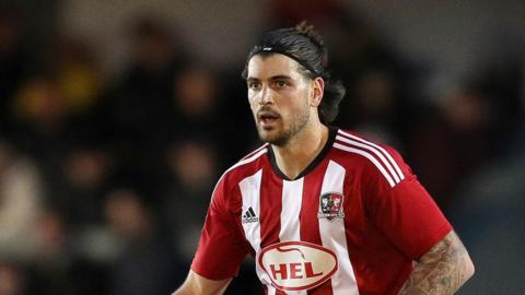 Defender Tristan Crama playing for Exeter City