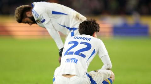 Leeds players Ao Tanaka and Jayden Bogle are dejected after drawing 3-3 at Hull