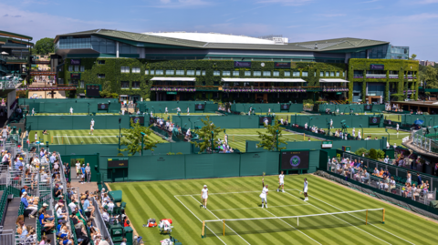 Serena Williams practising on Court Twelve with a backdrop of Centre Court as she prepares for the Wimbledon Lawn Tennis Championships at the All England Lawn Tennis and Croquet Club at Wimbledon on 27 June 27 2026 in London, England