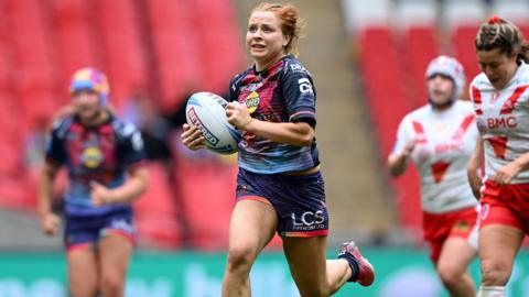 Wigan Warriors full back Grace Banks runs towards the line to score a try in the win over St Helens in the Women's Challenge Cup final at Wembley 