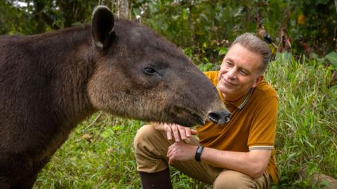 Chris Packham with a mountain tapir