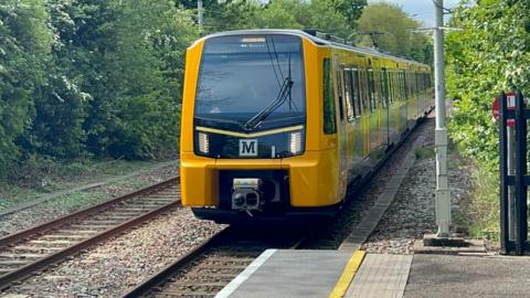 A new Metro on the tracks during daytime