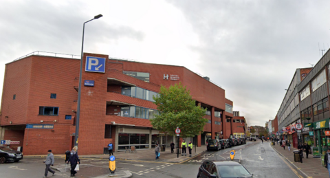 Exterior of Haymarket Shopping Centre, a red brick building with multiple storeys.