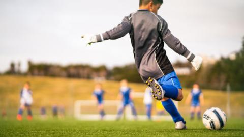 Children play football