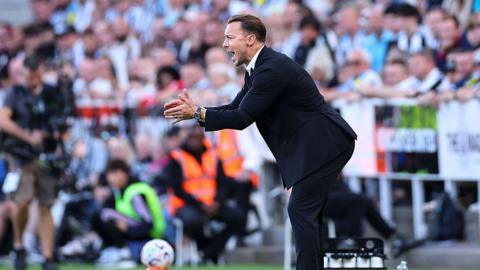 Newcastle United boss Matthias Jaissle encourages his players from his technical area