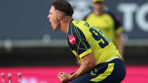Sonny Baker celebrates taking wicket