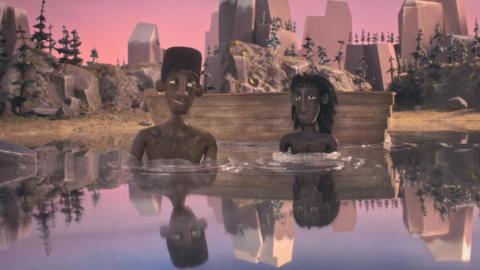A still from the animated film shows two boys sitting in calm water under a pink and purple sky.