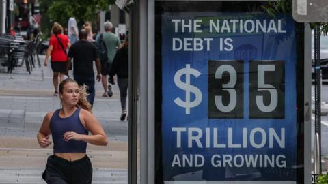 An electronic billboard displaying the current US National debt per person and as a nation at 35 Trillion dollars on  09 August, 2024 in Washington, DC