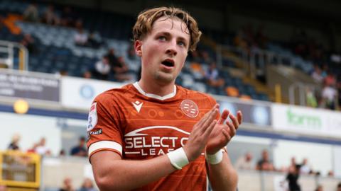 Reading midfielder Charlie Savage applauds the fans