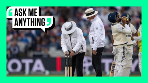 Umpires recording a light meter reading at Old Trafford with an Ask Me Anything border around them