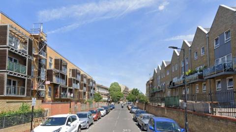 Image of new brick houses and balconies along Sumner Road in Peckham