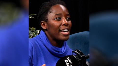 Kimberly Wilson, wearing a blue polo neck jumper, in the BBC studio.