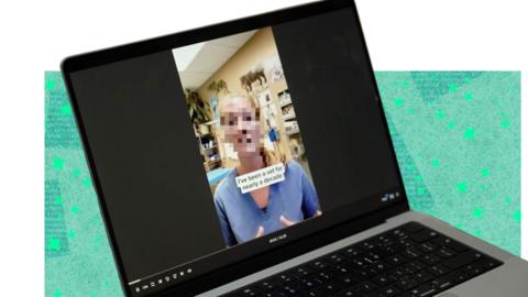 A laptop showing a video of a vet speaking on the screen