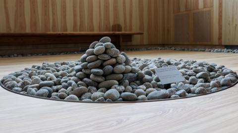 A pile of pebbles forms part of new Oslo memorial for 2011 massacre victims