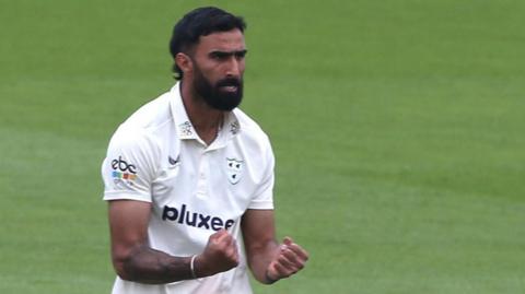 Yadvinder Singh celebrates taking a wicket for Worcestershire 