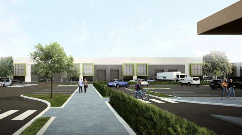 An artistic impression of part of the new Interchange South estate. There is a pedestrian walkway running south to north, with two people walking on it. It is lined by hedges and some trees. Industrial units are along the back edge and there are many parking spaces. A person wheels a bike across a zebra crossing and a white lorry is parked in front of the unit.