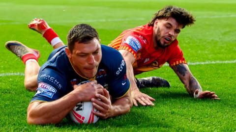 Ryan Hall dives in to score a try for Leeds Rhinos