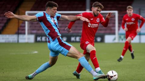 Will Evans of Scunthorpe United makes a tackle