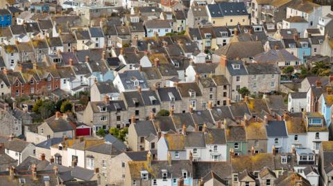 A bird's eye of houses at the Isle of Portland near Chesil Beach seen from the hilltop