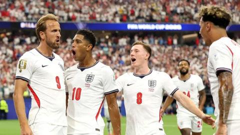 England's Harry Kane celebrates with team-mates after opening the scoring against Croatia